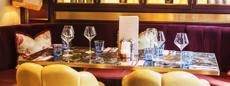 Dining table with wine glasses and place settings in a restaurant setting